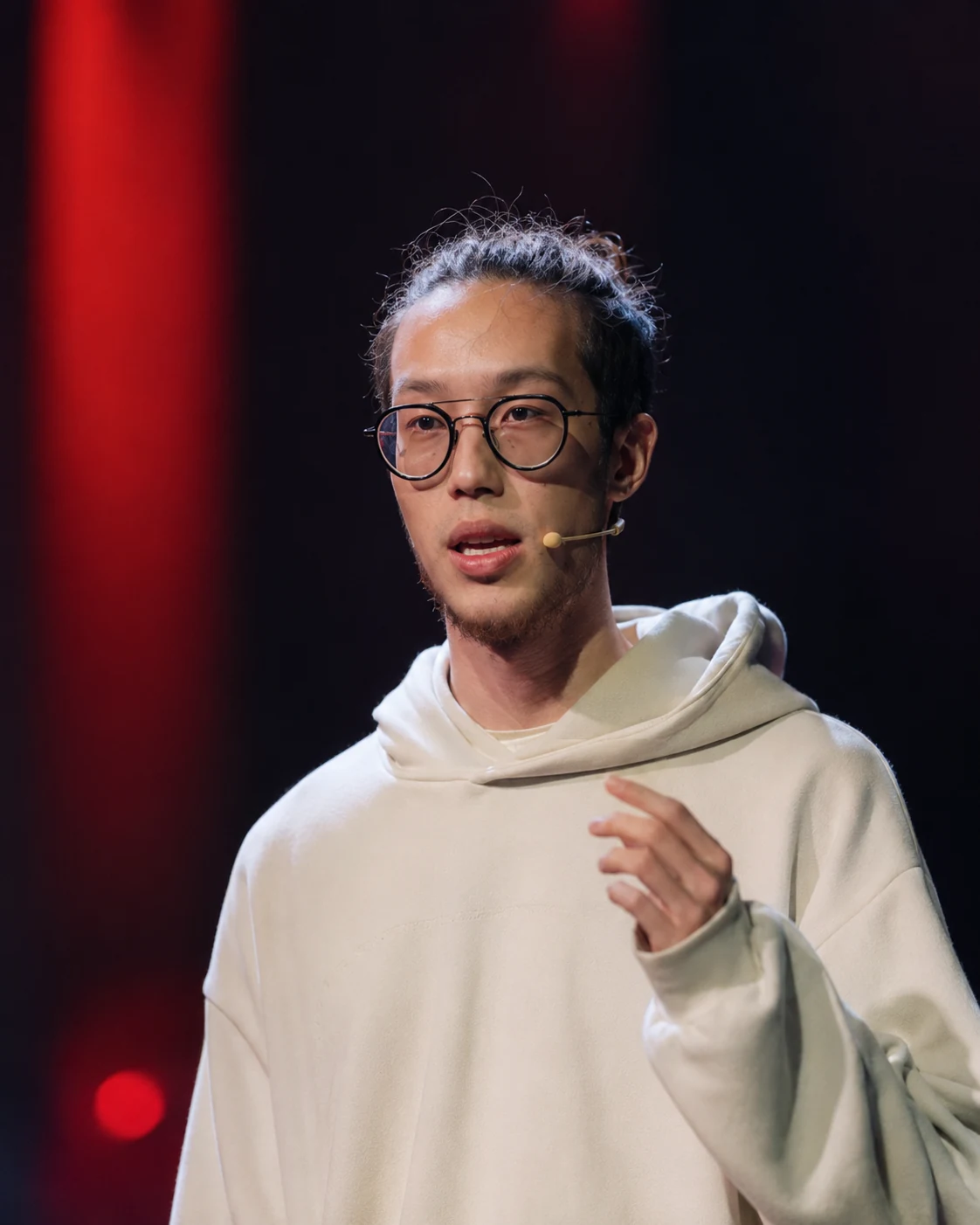 Marc Paul speaking on a TEDx stage